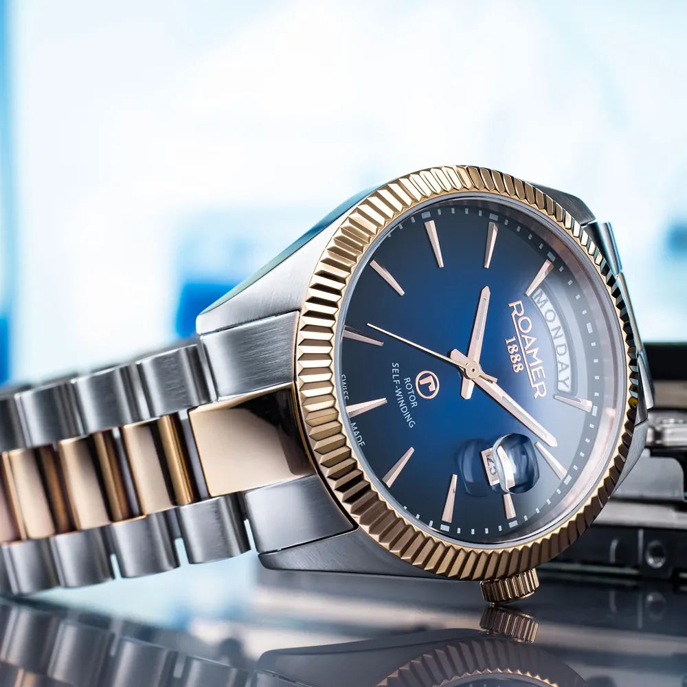 Roamer Primeline Daydate 42mm Men's Swiss Automatic Watch – Blue Dial, Rose Gold Hands, Stainless Steel Case, Sapphire Glass, 41-Hour Power Reserve