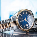Roamer Primeline Daydate 42mm Men's Swiss Automatic Watch – Blue Dial, Rose Gold Hands, Stainless Steel Case, Sapphire Glass, 41-Hour Power Reserve